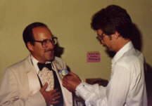 1982 - Michael pins wedding boutonniere on Dad, 8-7-82.